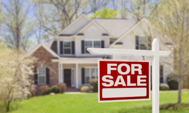 Home For Sale Real Estate Sign and House